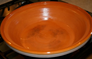 Heat oil in the base of the tagine over medium heat.