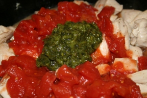 Add the tomatoes and basil. I used basil paste, my new favorite ingredient.