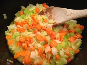 In a deep cast iron skillet or 2-quart saucepan, melt butter and saute onions, carrots and celery together until soft.