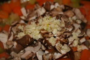 Add the mushrooms and garlic and cook through, about three to five minutes.